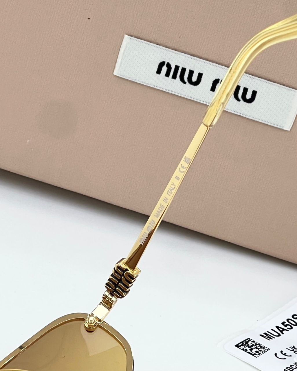 Óculos Miu Miu Gold