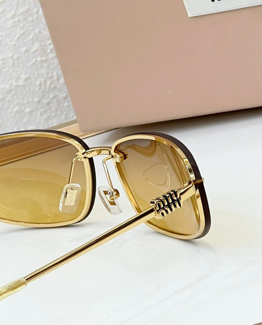 Óculos Miu Miu Gold