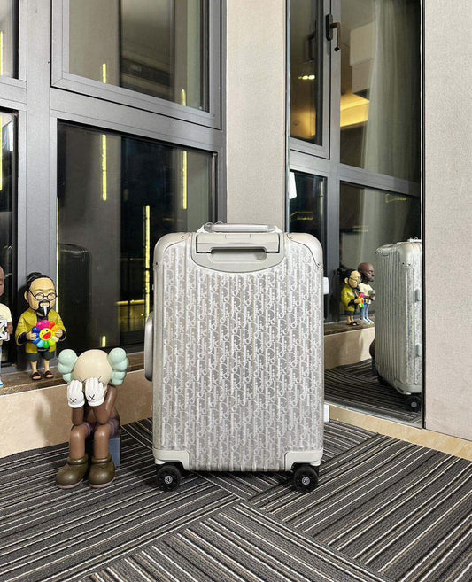 Mala Dior And Rimowa Carry-On Suitcase