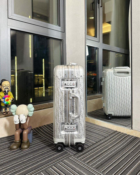 Mala Dior And Rimowa Carry-On Suitcase